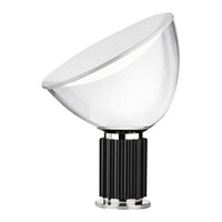 Clear glass lampshade with black ribbed base and shiny silver accents, modern design. 