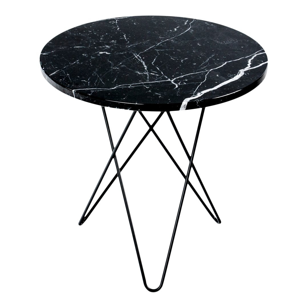 Round black marble table with white veining and sleek black metal legs, perfect for modern decor.