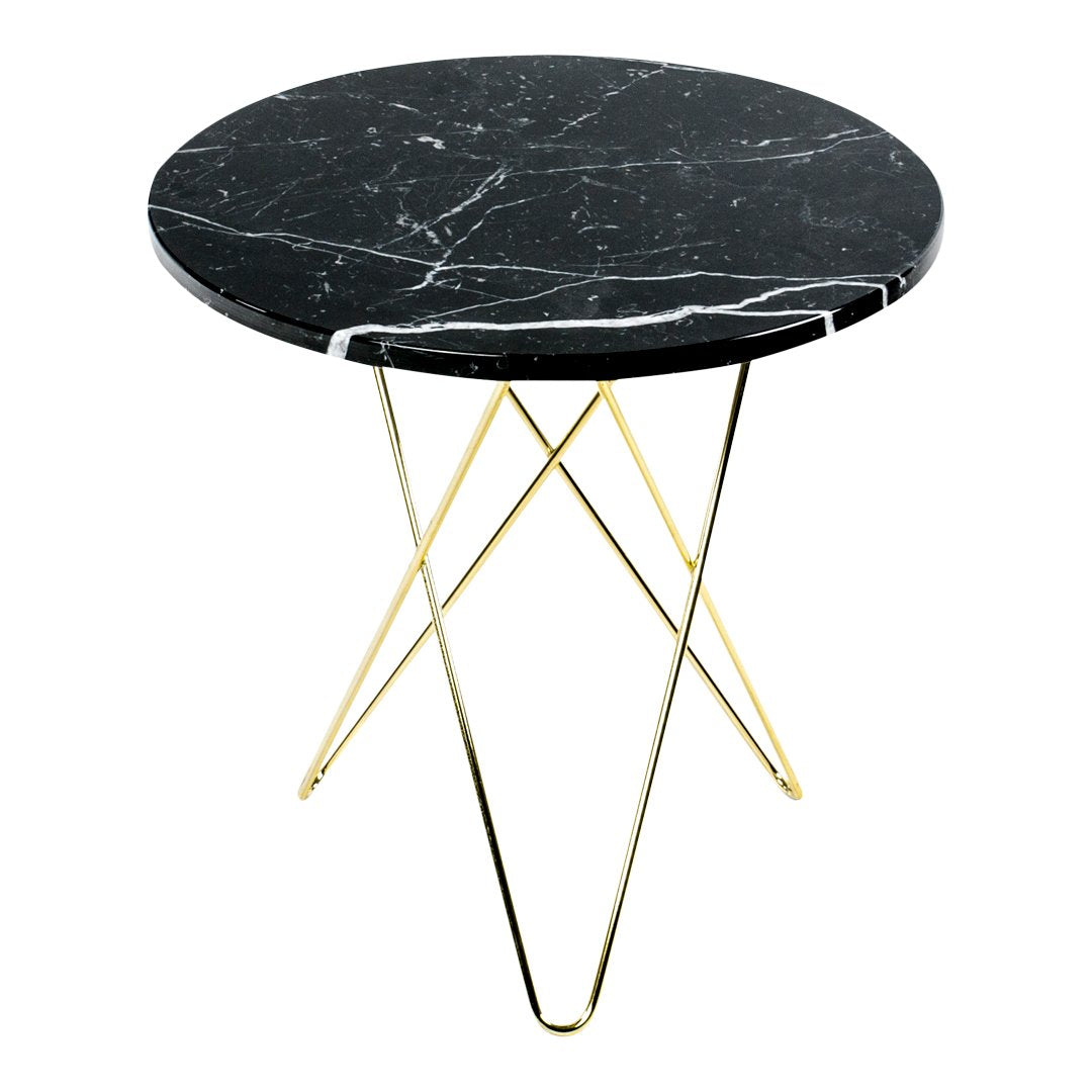 Round black marble table with white veins and golden metal tripod legs, modern and stylish design.