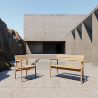 Light wood outdoor chairs with a minimalist design, featuring smooth, clean lines and a natural finish.