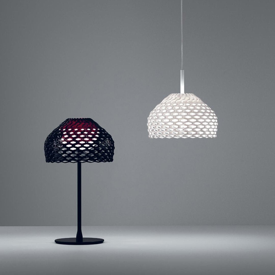 Black and white mesh-patterned lamps featuring textured designs in a contemporary setting.