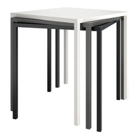 Modern nesting tables in white, gray, and black, featuring sleek, minimalist design and clean lines.
