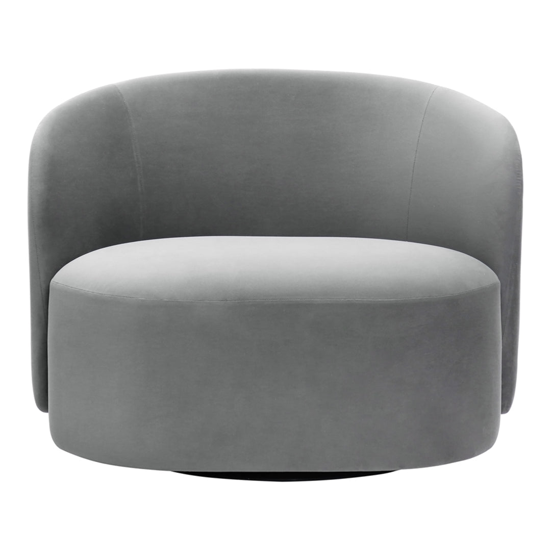 Round gray accent chair in soft velvet. Smooth, modern design with subtle curves and a sleek finish. Perfect for any space.