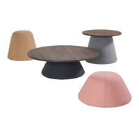 Assorted modern tables featuring earthy tones: tan, gray, black, and soft pink with smooth, rounded shapes.