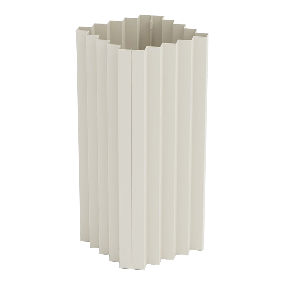 Textured beige vase with vertical pleats, adding a modern touch to any decor. Ideal for minimalist aesthetics.