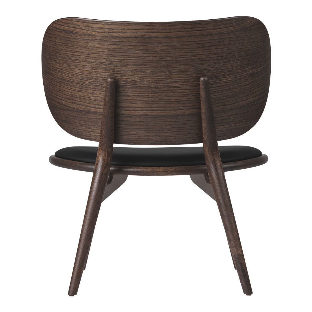 Dark wood chair with a smooth, curved backrest and contrasting black seat, showcasing modern minimalist design.