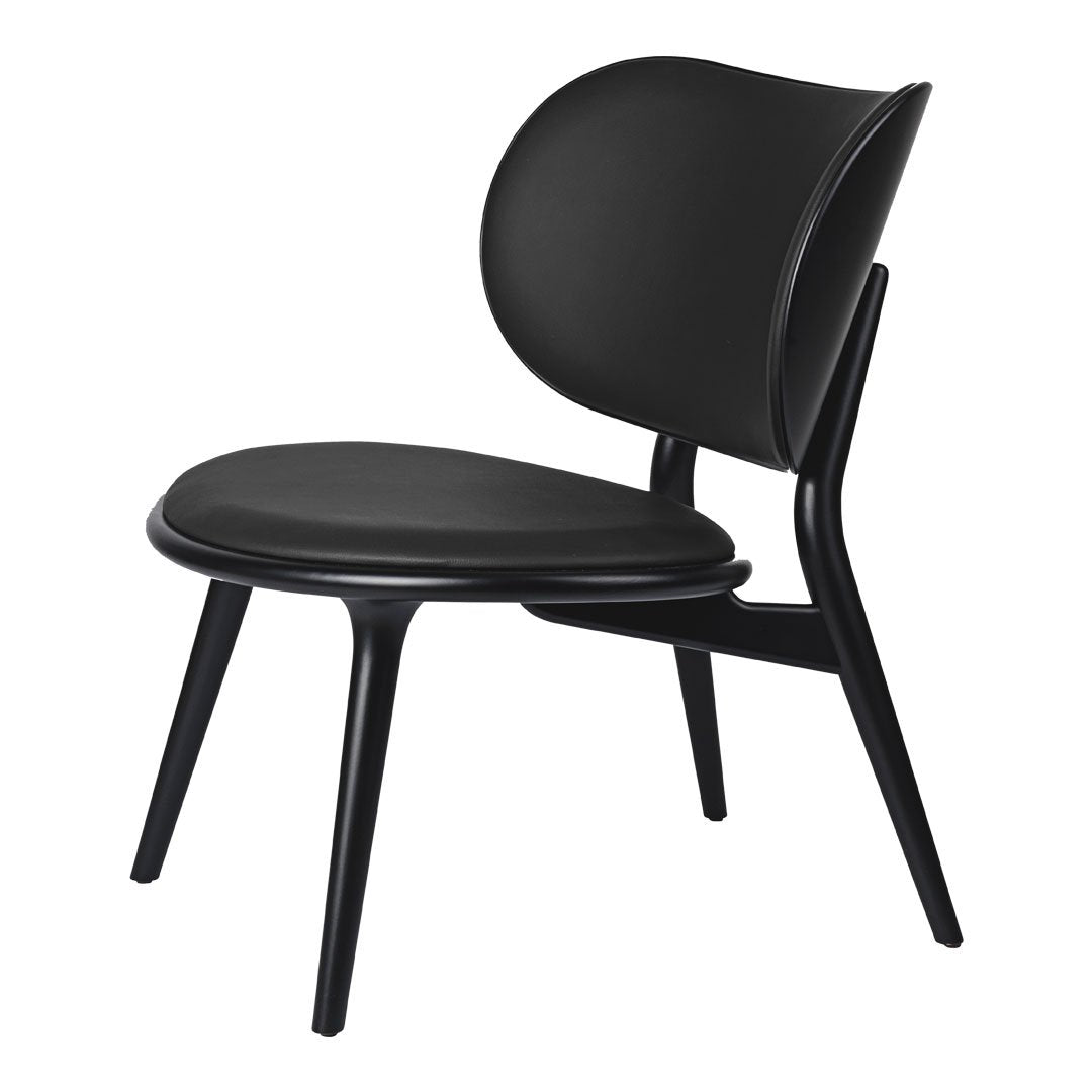 Black modern chair with a smooth, minimalist design and curved seat and backrest, perfect for contemporary decor.
