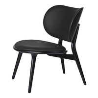 Black modern chair with a smooth, minimalist design and curved seat and backrest, perfect for contemporary decor.