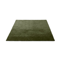 Solid olive green area rug with a smooth texture, perfect for adding a rich, earthy tone to any space.
