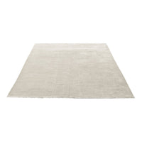 Light beige area rug with a smooth, solid texture, perfect for enhancing any living space.
