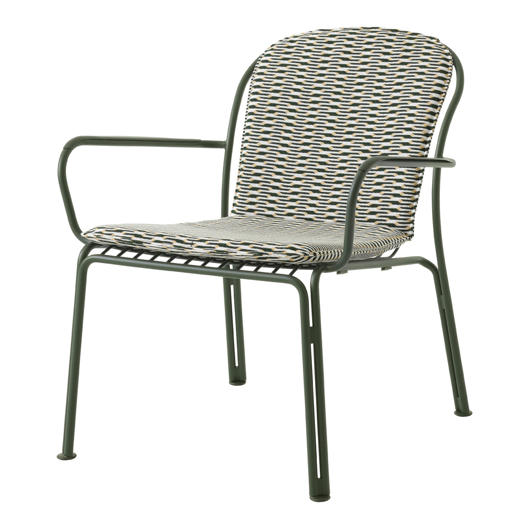 Green metal chair with a woven seat and back in a geometric pattern of gray, black, and cream.