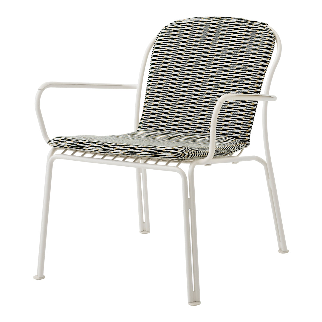 Stylish white metal chair with a woven seat featuring alternating black and white stripes and a geometric pattern.