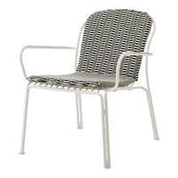 Stylish white metal chair with a woven seat featuring alternating black and white stripes and a geometric pattern.