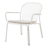White metal chair with a minimalist design and open slat pattern, featuring a cushioned seat for comfort.