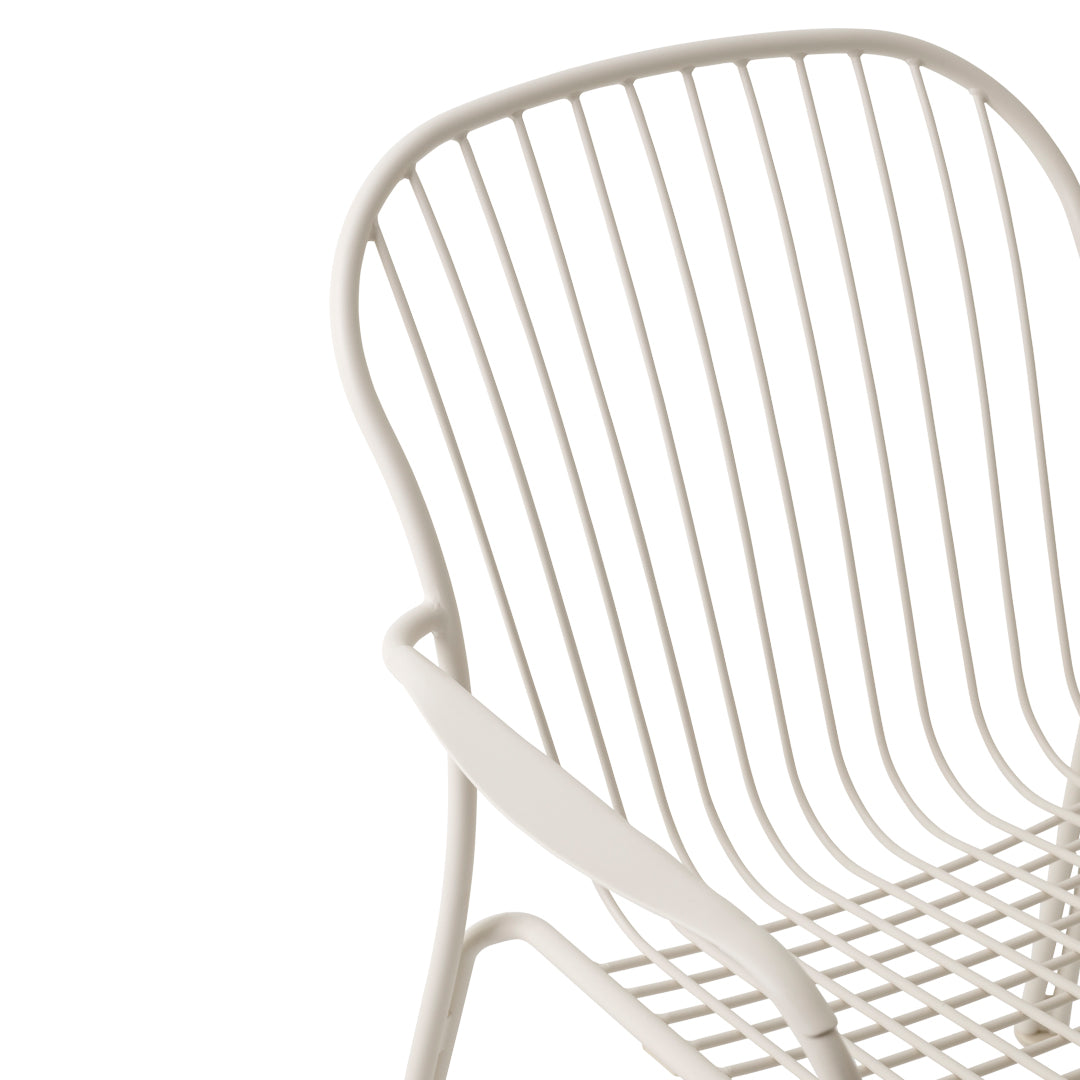 White metal chair with sleek lines and a grid pattern, ideal for contemporary decor.