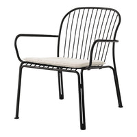 Black metal chair with a sleek design and light beige cushion, featuring minimalist lines and open patterns.