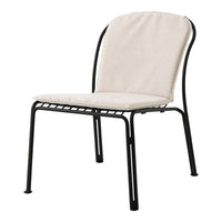 Cream-colored cushioned chair with a sleek black metal frame, perfect for modern indoor or outdoor decor.