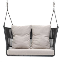 Black swinging sofa with beige cushions, featuring a modern geometric pattern for stylish outdoor decor.