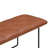 Brown tufted bench cushion with sleek black metal legs, adding modern elegance to any space.