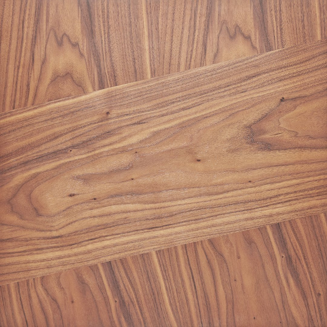 Rich brown wooden flooring with dark streaks and a smooth, glossy finish, showcasing natural grains and patterns.