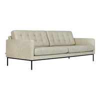 Light beige tufted sofa with a textured fabric and black metal legs, perfect for modern decor.