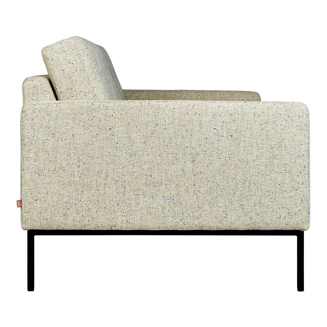 Beige textured fabric sofa with subtle multicolored flecks, minimalist black metal frame. Modern and stylish design.