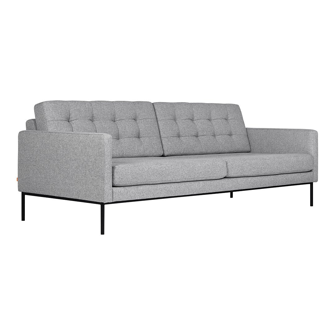 Gray upholstered sofa with tufted design and sleek black metal legs, perfect for modern interiors.