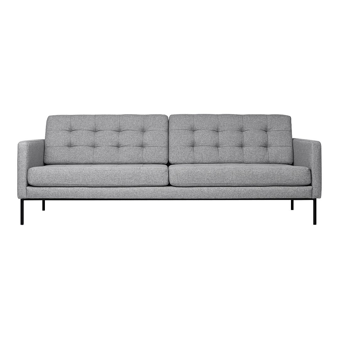 Gray mid-century modern sofa with tufted upholstery and sleek metal legs. Perfect for stylish living spaces.