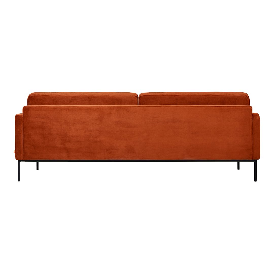 Back view of a plush rust-orange sofa with a smooth, solid fabric texture and sleek black metal legs.