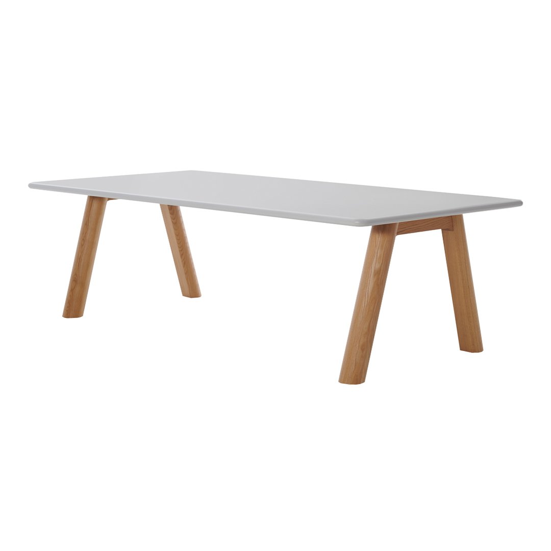 Modern white tabletop with natural wood legs, showcasing a minimalist design and sleek lines.
