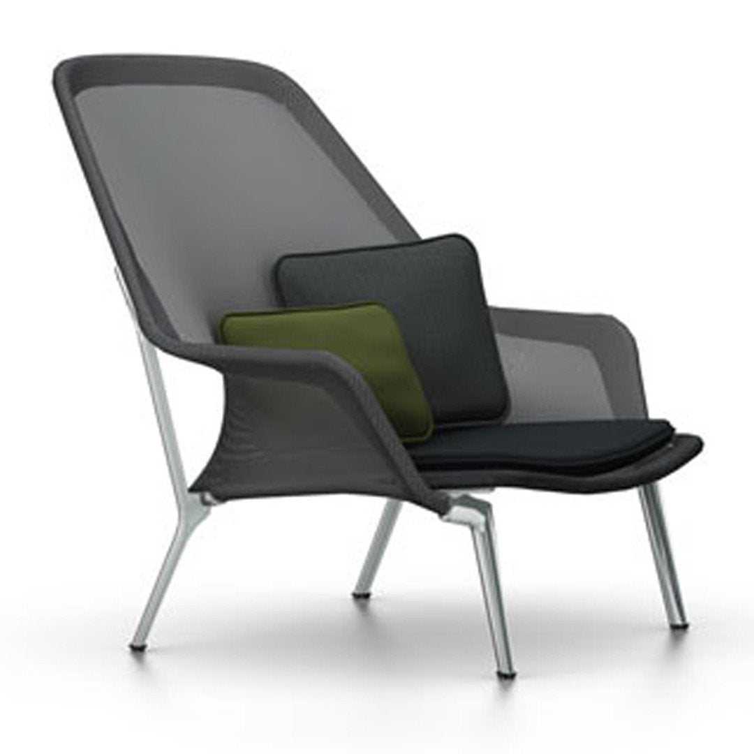 Modern lounge chair featuring gray mesh fabric and stylish green and black cushions. Sleek silver legs complete the design.