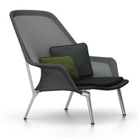 Modern lounge chair featuring gray mesh fabric and stylish green and black cushions. Sleek silver legs complete the design.
