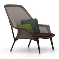 Modern chair featuring a neutral gray base with vibrant green, dark blue, and rich burgundy cushions.