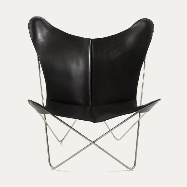 Black leather butterfly chair with sleek, minimalist design and stainless steel frame, showcasing a modern aesthetic.