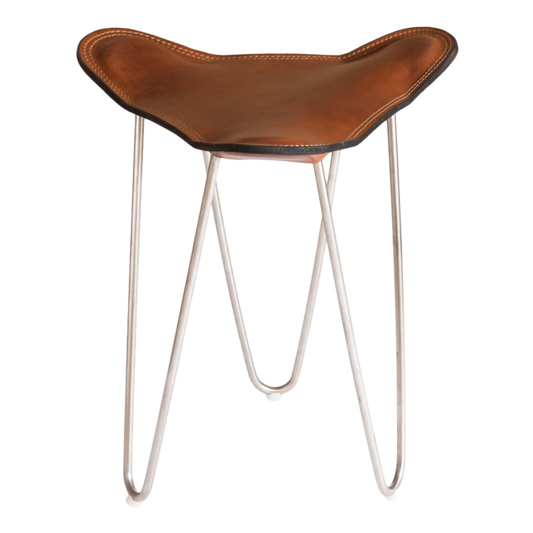 Brown leather stool with a sleek, modern design and chrome legs, showcasing a unique, organic shape.