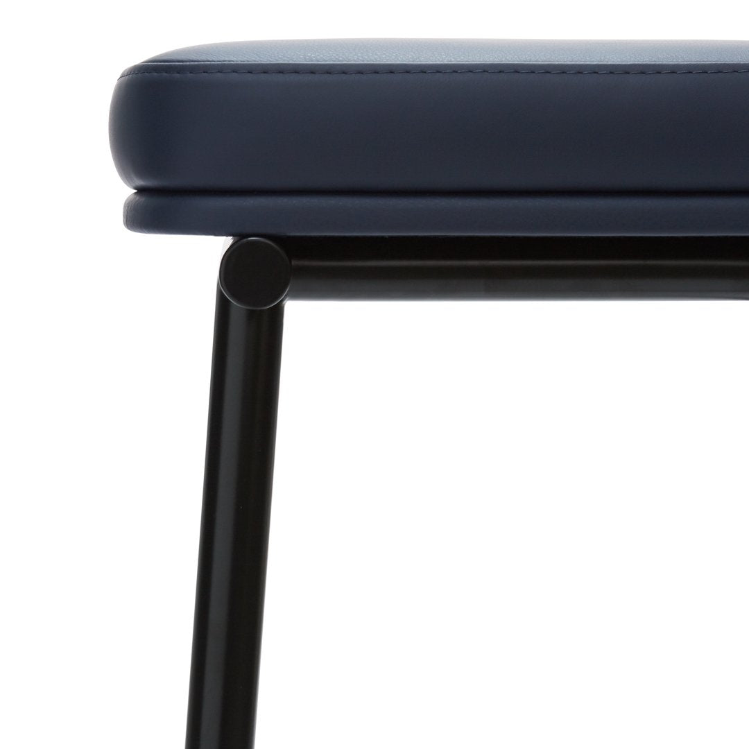 Navy blue padded seat on a sleek black metal frame, featuring a smooth, minimalist design.