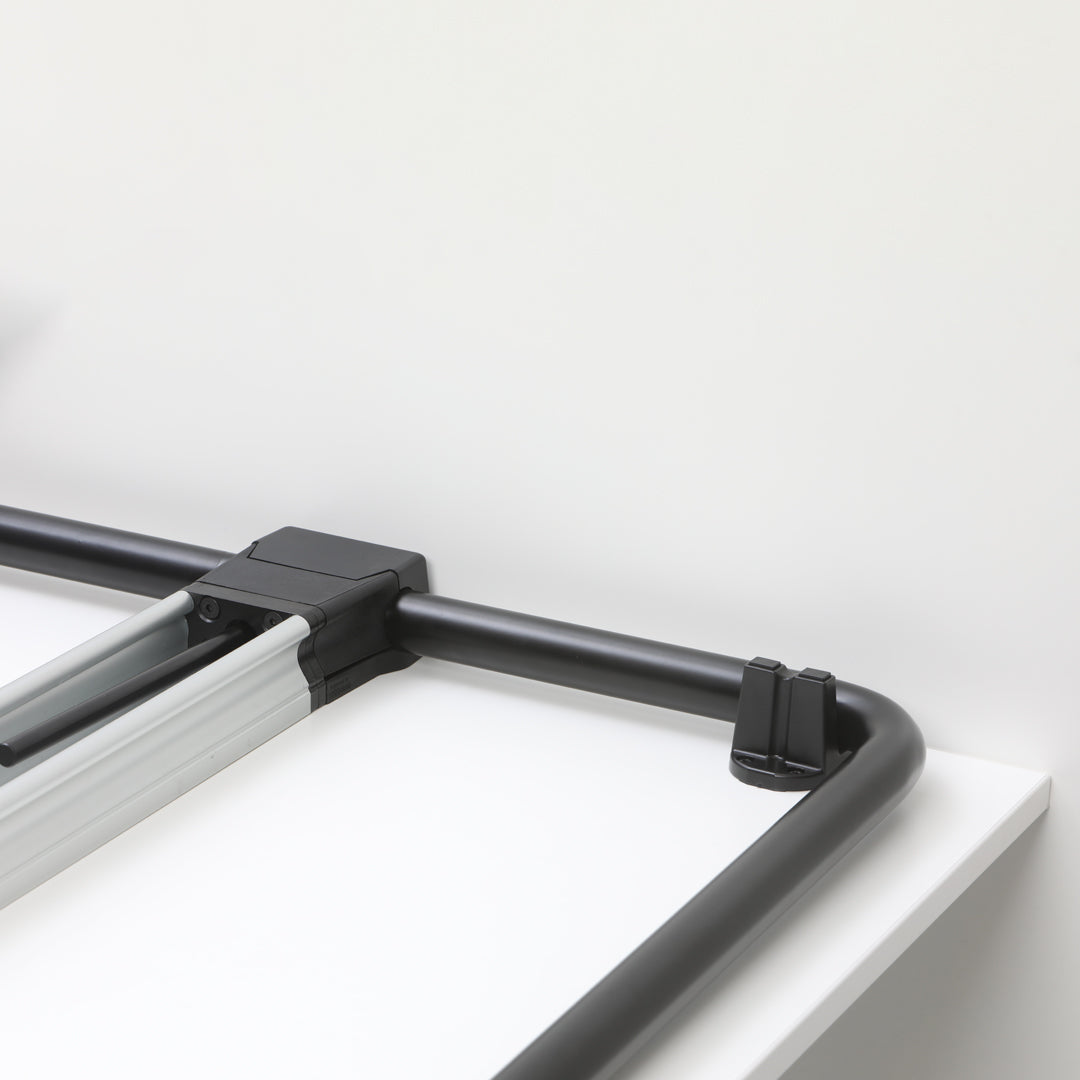 Black and silver metal frame with clean lines against a minimalistic white background.