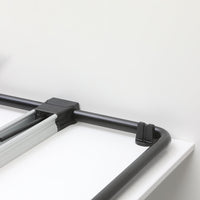 Black and silver metal frame with clean lines against a minimalistic white background.