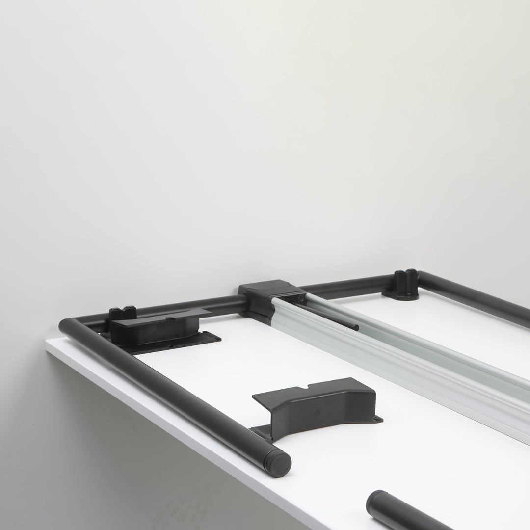 Black frame with silver accents on a clean white surface, showcasing modern, minimalist design elements.