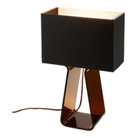 Modern black and amber table lamp with a sleek geometric design. Ideal for stylish home decor.