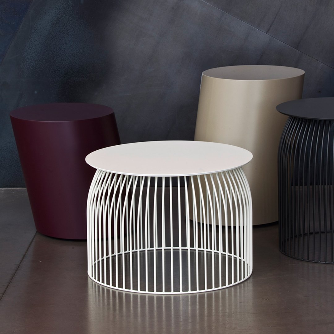 Modern side tables in cream, burgundy, beige, and black with sleek lines and geometric patterns. Perfect for contemporary decor.