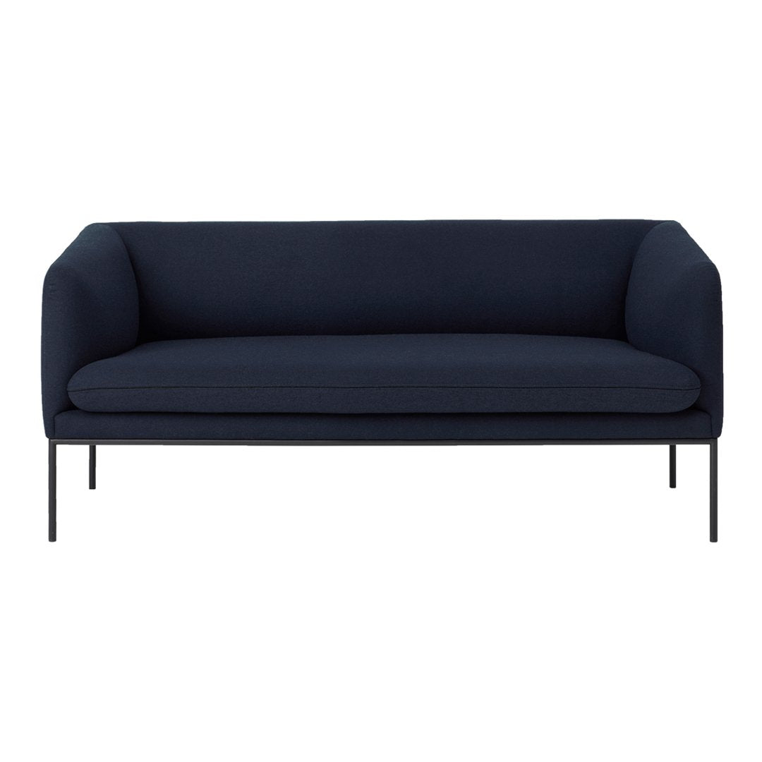 Navy blue minimalist sofa with clean lines and solid fabric upholstery. Ideal for modern living spaces.