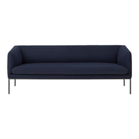 Navy blue sofa with a sleek, minimalist design and smooth fabric texture on a black metal frame.