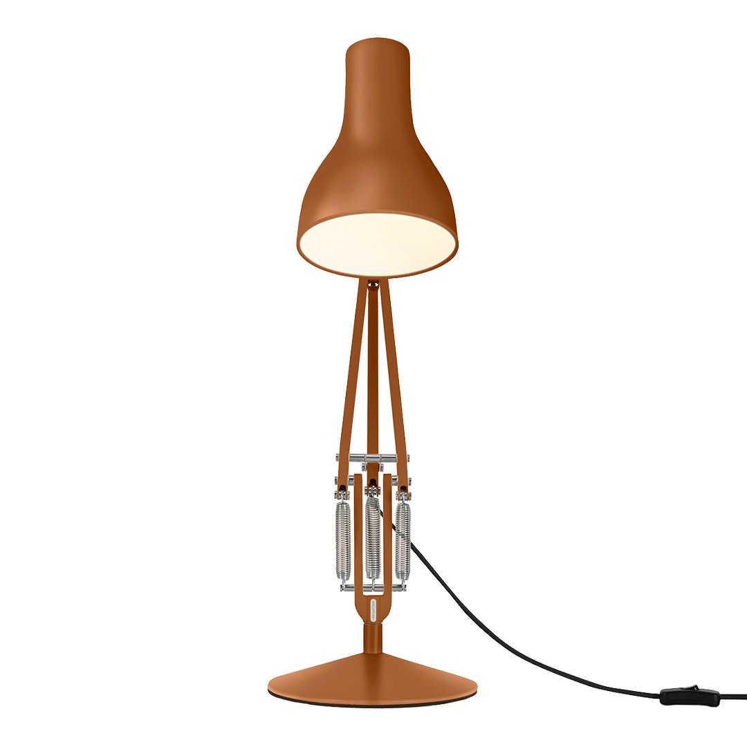 Copper-toned lamp with a sleek, modern design and a smooth, matte finish, featuring geometric patterns.