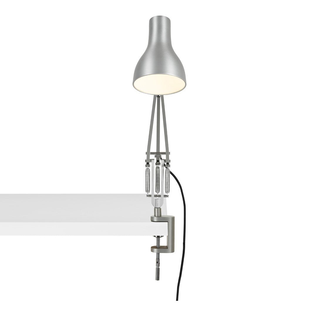 Silver metallic lamp with a sleek, modern design, featuring a minimalist clamp and a light grey cord.