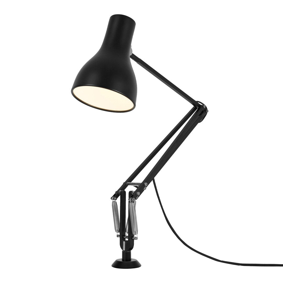 Black desk lamp with a sleek design and white light shade, featuring adjustable arms for versatile positioning.