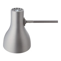 Sleek silver desk lamp with a smooth metallic finish and minimalist design.