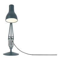 Modern blue-gray lamp with a sleek design and black cord, featuring a simple geometric pattern.