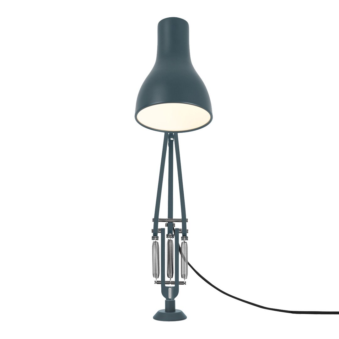 Sleek blue lamp with a minimalist design, featuring a matte finish and contrasting metallic accents.
