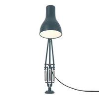 Sleek blue lamp with a minimalist design, featuring a matte finish and contrasting metallic accents.